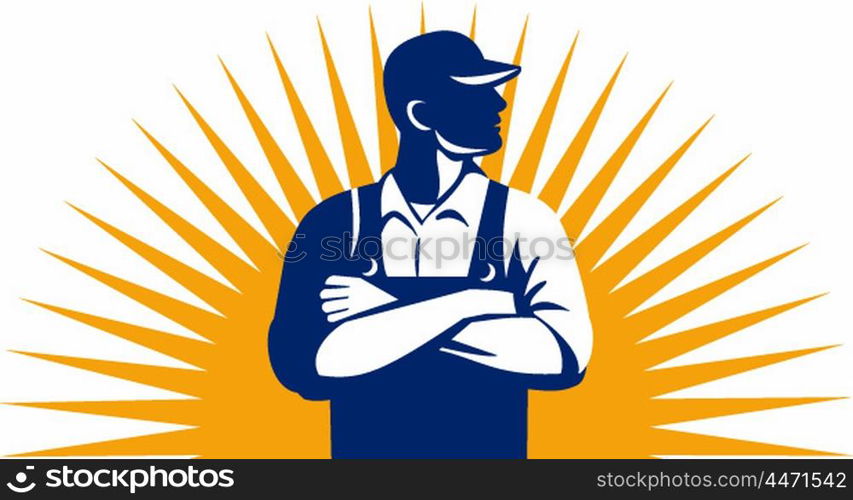 Illustration of an organic farmer wearing hat and overalls arms folded looking to the side viewed from front with sunburst in the background done in retro style.