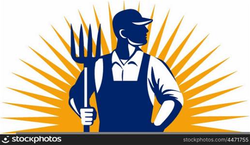 Illustration of organic farmer holding pitchfork looking to the side with one hand in pocket viewed from front with sunburst in the background done in retro style.