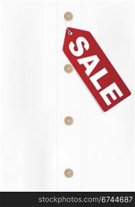 Illustration of Red Sale Sign on White Shirt - With Copyspace