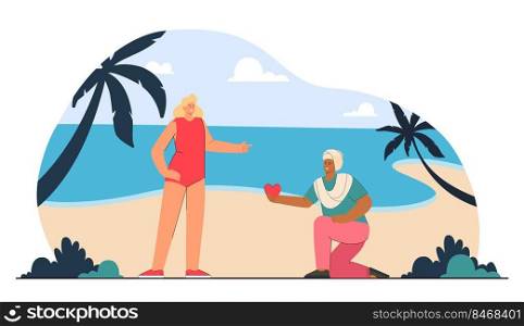 Indian man on one knee offering red heart to blond woman in swimsuit on seashore. Vacation romance flat vector illustration. Love, relationship concept for banner, website design or landing web page