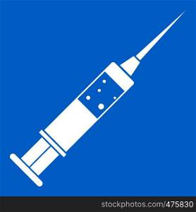 Injection syringe icon white isolated on blue background vector illustration. Injection syringe icon white