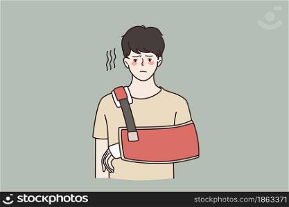 Injury and physical problem concept. Young sad frustrated man cartoon character standing with injured arm feeling unhappy vector illustration . Injury and physical problem concept.
