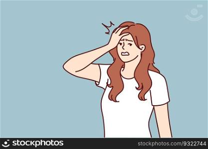 Irritated woman making face palm gesture after learning about delay in delivery from courier. Irritated girl puts hand on forehead showing anxiety and fatigue associated with psychological pressure. Irritated woman making face palm gesture after learning about delay in delivery from courier