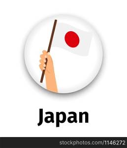 Japan flag in hand, round icon with shadow isolated on white. Human hand holding flag, vector illustrattion. Japan flag in hand, round icon