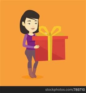 Joyful asian woman holding a box with gift in hands. Happy woman holding gift box. Young woman standing with gift box. Girl buying a present. Vector flat design illustration. Square layout.. Joyful asian woman holding box with gift.