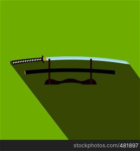 Katana on a wooden stand flat icon on a green background. Katana on a wooden stand flat icon