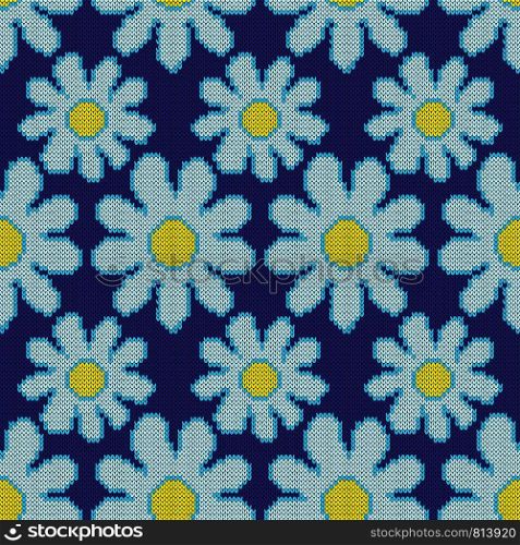 Knitted seamless pattern with flowers in blue hues on the dark background, vector as fabric texture