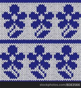 Knitting ornamental seamless colourful vector pattern with rows of dark blue stylized flowers and over white as a knitted fabric texture