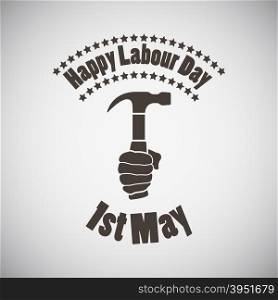 Labour day emblem with hammer in hand. Vector illustration.