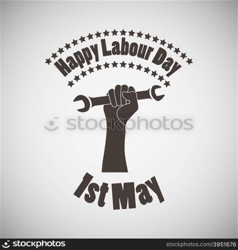 Labour day emblem with wrench in fist. Vector illustration.