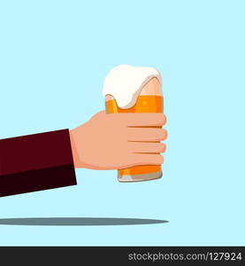 Left hand holding a beer glass and blue background