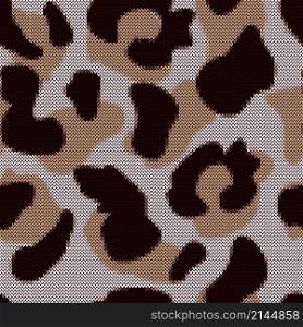 Leopard seamless pattern in knitted style. Jacquard cheetah fur background. Abstract animal skin wallpaper. Design for fabric , textile print, surface, wrapping, cover. Vintage vector illustration. Leopard seamless pattern in knitted style. Jacquard cheetah fur background.