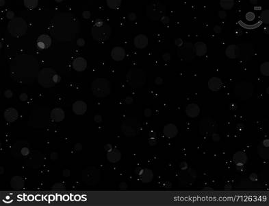 Light bokeh on a black background. Abstract black background.