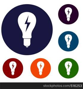 Light bulb with lightning inside icons set in flat circle red, blue and green color for web. Light bulb with lightning inside icons set