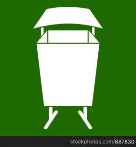 Litter waste bin icon white isolated on green background. Vector illustration. Litter waste bin icon green