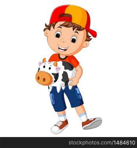 little boy holding cow bank