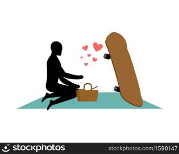 Lover skateboarding. Guy and Skateboard on picnic. Meal in nature. blanket and basket for food on lawn. Romantic date. Love extreme sports