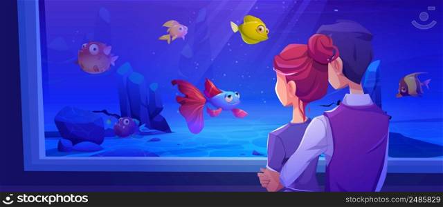Loving couple stand front of aquarium with fishes. Young man hug woman from back. Cartoon male and female characters look on underwater animals swim in water in zoo or oceanarium, Vector illustration. Loving couple stand front of aquarium with fishes