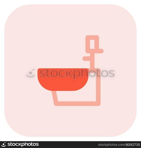 Low mounted toilet seat with faucet.