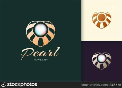 Luxury and elegant pearl with clam logo represent jewelry or gem fit for beauty and fashion brand