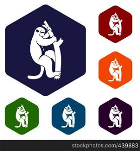Macaque on a tree icons set hexagon isolated vector illustration. Macaque on a tree icons set hexagon