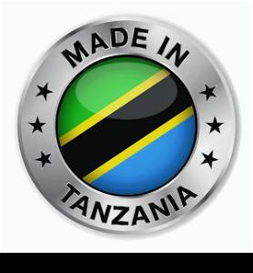 Made in Tanzania silver badge and icon with central glossy Tanzanian flag symbol and stars. Vector EPS10 illustration isolated on white background.
