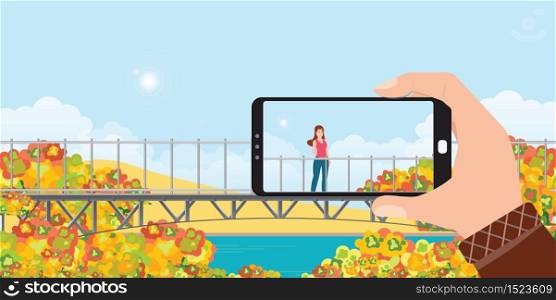 Make a photo of woman landscape by smartphone in autumn landscape mountains with colors of leaves.cartoon Vector illustration.