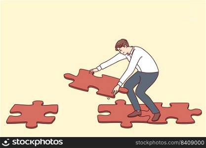 Man connecting jigsaw puzzle pieces making way or road to walk. Male find solution solving problem answering question. Flat vector illustration.. Man connecting jigsaw puzzle making way