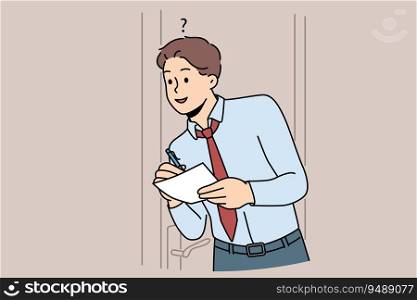Man eavesdrops on business secrets standing near office door and writing insider information at paper. Guy is spying on boss and trying to get hold of insider data of company or corporation. Man eavesdrops on business secrets standing near office door and writing insider information