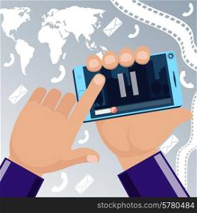 Man holding smartphone in his hand and watching movie video pause with cinema tape map sms on gray background