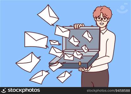 Man opens case with letters symbolizing mailing lists and business alerts with commercial offers. Guy stands with suitcase filled with envelopes and letters, for concept of annoying spam. Man opens case with letters symbolizing mailing lists and business alerts with commercial offers