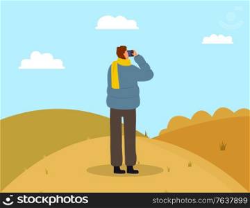 Man photographing picturesque view. Male wearing casual clothes and scarf standing on grass and making photo. Back view of person photographer holding shooting landscape of autumn park vector. Photographer Making Photo of Landscape Vector