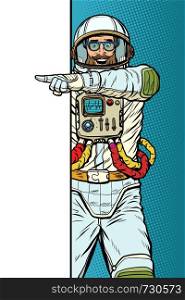 man Pop art retro vector Illustrator vintage kitsch drawing. man astronaut. Point to copy space poster