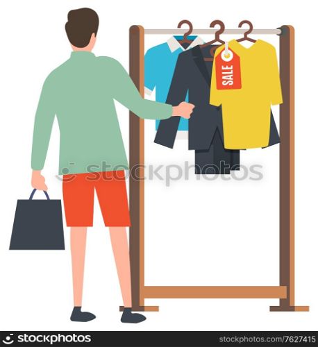 Man shopping vector, male holding bag in hands flat style, client choosing clothes. Store with clothing, sale on shirts and jackets, discounts promotion. Man Choosing Stylish Clothes at Shipping Center
