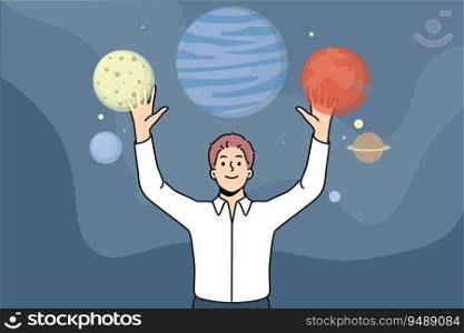 Man stands among planets of space and enjoys virtual reality technology that allows to travel around galaxy. Guy who loves space explores universe thanks to digital planetarium with VR. Man stands near planets space and enjoys VR technology that allows to travel around galaxy