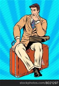 Man traveler sitting on a suitcase pop art retro style. Travel and tourism. business trip. Man traveler sitting on a suitcase