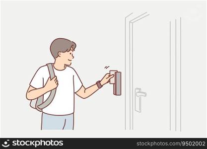Man uses key card to open door to hotel room or hostel during tourist trip or business trip. Guy with key card opens electronic lock, gaining access to back office for company employees.. Man uses key card to open door to hotel room or hostel during tourist trip or business trip