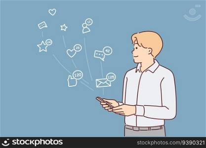 Man with phone uses social networks and apps to communicate with friends stands near icons symbolizing internet chatting. Guy with smartphone registers in social networks and instant messengers. Man with phone uses social networks stands near icons symbolizing internet chatting