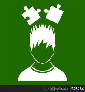 Man with puzzles over head icon white isolated on green background. Vector illustration. Man with puzzles over head icon green