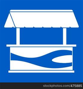 Market stall with awning icon white isolated on blue background vector illustration. Market stall with awning icon white