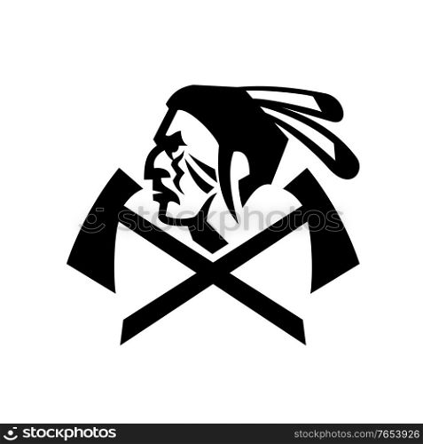Mascot black and white illustration of head of a Native American Indian warrior with feathers and crossed tomahawk or hatchet viewed from side on isolated background in retro style.. Head of Native American Indian Warrior with Crossed Tomahawk Mascot Black and White