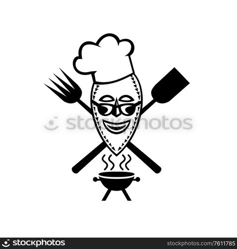 Mascot icon illustration of a barbecue chef wearing African mask with crossed fork and spatula with bbq grill viewed from front on isolated background in retro styled in black and white.. Barbecue Chef Wearing African Mask Mascot