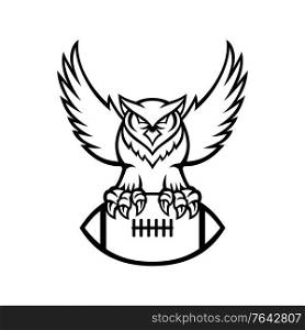 Mascot illustration of a great horned owl, tiger owl or hoot owl, a large owl native to the Americas, clutching an American football ball viewed from front in retro black and white style.. Great Horned Owl or Tiger Owl Clutching American Football Ball Mascot Black and White