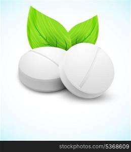 Medical concept. Two pills with leaves