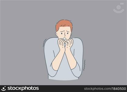 Mental health and inner fears concept. Young stressed man cartoon character standing biting nails feeling bad with ghosts at wall from inside fears vector illustration . Mental health and inner fears concept.