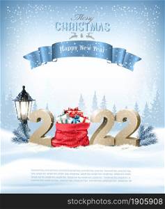 Merry Christmas and Happy New Year 2022. Golden 3D numbers with a red sack full presents on a winter landscape background. Vector