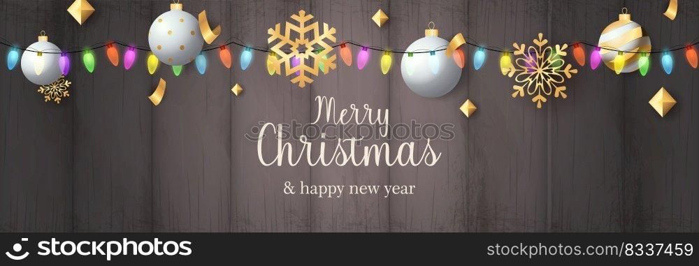 Merry Christmas banner with balls on grey wooden ground. Lettering can be used for invitations, post cards, announcements