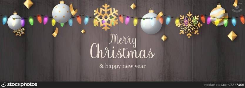 Merry Christmas banner with balls on grey wooden ground. Lettering can be used for invitations, post cards, announcements