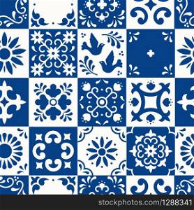 Mexican talavera seamless pattern. Ceramic tiles with flower, leaves and bird ornaments in traditional majolica style from Puebla. Mexico floral mosaic in classic blue and white. Folk art design.