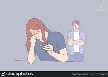 Misunderstanding and divorce concept. Young stressed unhappy woman sitting with marriage ring and feeling irritated by angry husband behavior feeling pain and ready to divorce . Misunderstanding and divorce concept